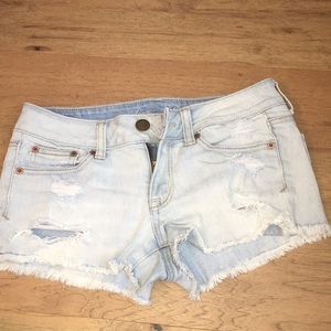 Ripped jean shorts, light wash